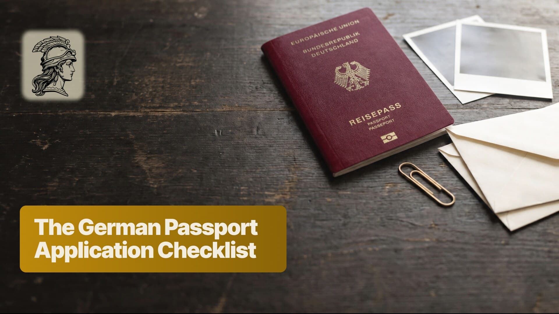 A German passport on a dark desk with blank biometric photographs, a cream envelope and a brass paperclip - the documents a passport application by descent collects